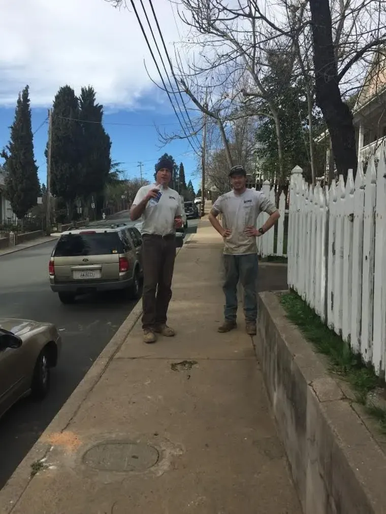 Tech on a Sutter Creek sidewalk during a main line job